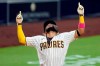 San Diego Padres' Fernando Tatis Jr. reacts after hitting a home run during the third inning of a baseball game against the Texas Rangers, Wednesday, Aug. 19, 2020, in San Diego. (AP Photo/Gregory Bull)