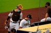San Diego Padres starting pitcher Garrett Richards, center, walks into the dugout followed by catcher Austin Nola after the team's baseball game against the San Francisco Giants was postponed Friday, Sept. 11, 2020, in San Diego, minutes before the scheduled first pitch after someone in the Giants organization tested positive for COVID-19. (AP Photo/Gregory Bull)