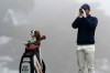 Rory McIlroy, of Northern Ireland, checks the yardage from the third tee during practice for the PGA Championship golf tournament at TPC Harding Park in San Francisco, Tuesday, Aug. 4, 2020. (AP Photo/Jeff Chiu)