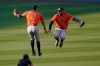 Houston Astros' Carlos Correa, left, celebrates with George Springer after they defeated the Oakland Athletics in Game 1 of a baseball American League Division Series in Los Angeles, Monday, Oct. 5, 2020. (AP Photo/Ashley Landis)