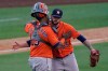 Houston Astros catcher Martin Maldonado, left, hugs relief pitcher Ryan Pressly after they defeated the Oakland Athletics in Game 1 of a baseball American League Division Series in Los Angeles, Monday, Oct. 5, 2020. (AP Photo/Ashley Landis)