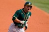 Oakland Athletics' Ramon Laureano reacts as he rounds the bases on his three-run home run against the Houston Astros during the second inning of Game 4 of a baseball American League Division Series in Los Angeles, Thursday, Oct. 8, 2020. (AP Photo/Marcio Jose Sanchez)
