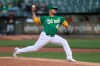 Oakland Athletics pitcher Frankie Montas throws to a Detroit Tigers batter during the first inning of a baseball game in Oakland, Calif., Friday, April 16, 2021. (AP Photo/Jed Jacobsohn)