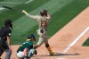 San Diego Padres' Fernando Tatis Jr hits a solo home run against the Oakland Athletics during the seventh inning of a baseball game in Oakland, Calif., Sunday, Sept. 6, 2020. (AP Photo/Jed Jacobsohn)