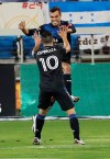 San Jose Earthquakes forward Cristian Espinoza (10) celebrates with forward Chris Wondolowski, who scored a goal against the Real Salt Lake during the first half of an MLS soccer match Wednesday, Oct. 28, 2020, in San Jose, Calif. (AP Photo/Josie Lepe)