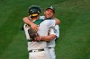 Oakland Athletics pitcher Liam Hendriks celebrates with catcher Sean Murphy after striking out Chicago White Sox's Nomar Mazara for the final out of Game 3 of an American League wild-card series, Thursday, Oct. 1, 2020, in Oakland, Calif. The A's won 6-4. (Jose Carlos Fajardo//Bay Area News Group via AP)