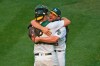 Oakland Athletics pitcher Liam Hendriks, right, celebrates with catcher Sean Murphy after striking out Chicago White Sox's Nomar Mazara for the final out in Game 3 of an American League wild-card baseball series in Oakland, Calif., Thursday, Oct. 1, 2020. The A's won 6-4. (Jose Carlos Fajardo/Bay Area News Group via AP)