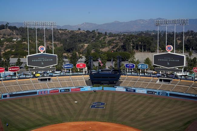 Tommy Lasorda's retired No. 2 is painted on the outfield grass at Dodger Stadium, Friday, Jan. 8, 2021, in Los Angeles. Lasorda, the fiery Hall of Fame manager who guided the Los Angeles Dodgers to two World Series titles and later became an ambassador for the sport he loved during his 71 years with the franchise, has died. He was 93. (AP Photo/Marcio Jose Sanchez)