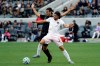 Los Angeles FC's Carlos Vela, left, defends on Inter Miami CF's Lee Nguyen during the second half of an MLS soccer match Sunday, March 1, 2020, in Los Angeles. (AP Photo/Marcio Jose Sanchez)