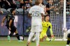 Los Angeles FC forward Diego Rossi, left, scores on Real Salt Lake goalkeeper David Ochoa, right, as midfielder Everton Luiz watches during the first half of a Major League Soccer match Saturday, July 17, 2021, in Los Angeles. (AP Photo/Mark J. Terrill)