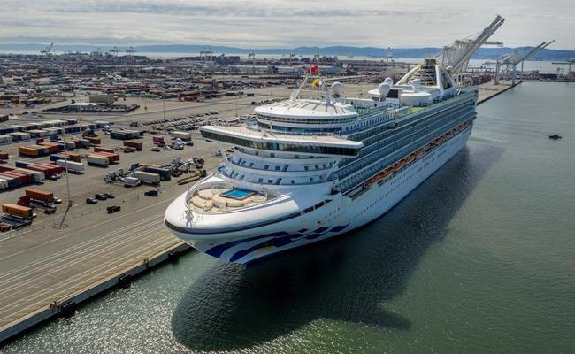 The Grand Princess docks at the Port of Oakland in Oakland, Calif., on Monday, March 9, 2020. The cruise ship, which had maintained a holding pattern off the coast for days, is carrying multiple people who tested positive for COVID-19, a disease caused by the new coronavirus. (AP Photo/Noah Berger)