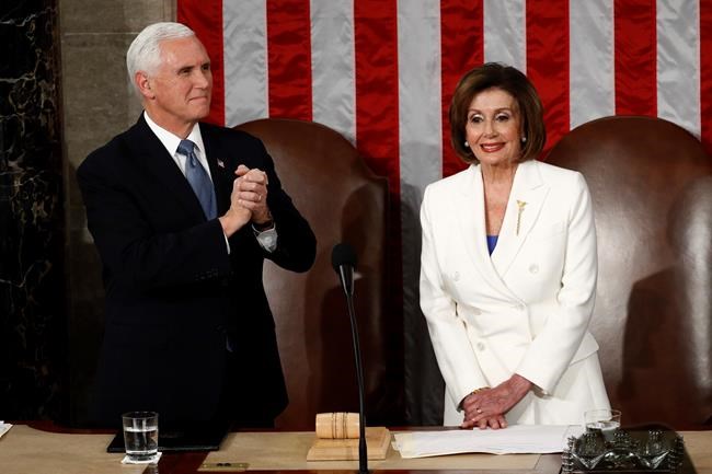 Vice President Mike Pence and House Speaker Nancy Pelosi of Calif., arrive before President Donald Trump delivers his State of the Union address to a joint session of Congress on Capitol Hill in Washington, Tuesday, Feb. 4, 2020. (AP Photo/Patrick Semansky)