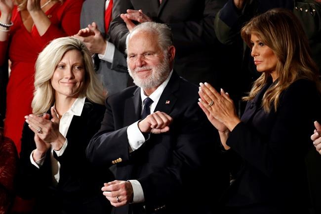 Rush Linbaugh reacts as first Lady Melania Trump, and his wife Kathryn, applaud, as President Donald Trump delivers his State of the Union address to a joint session of Congress on Capitol Hill in Washington, Tuesday, Feb. 4, 2020. (AP Photo/Patrick Semansky)