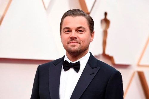 FILE - In this Feb. 9, 2020, file photo, Leonardo DiCaprio arrives at the Oscars in Los Angeles. DiCaprio is helping to launch the $12 million America’s Food Fund aimed at helping low-income families, the elderly and those whose jobs have been disrupted by the coronavirus pandemic. Among those teaming up for the launch are philanthropist Laurene Powell Jobs, Apple and the Ford Foundation. (Photo by Jordan Strauss/Invision/AP, File)