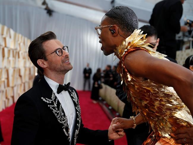 Brad Goreski, left, and Billy Porter chat on the red carpet at the Oscars on Sunday, Feb. 9, 2020, at the Dolby Theatre in Los Angeles. (AP Photo/John Locher)