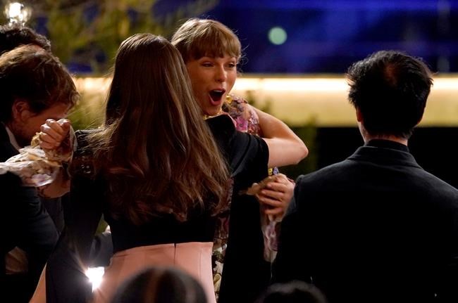 Taylor Swift reacts as she3 is announced as winner of the award for album of the year for