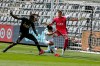 Austin FC midfielder Cecilio Dominguez, center, heads the ball against Los Angeles FC goalkeeper Pablo Sisniega, right, while Jesus David Murillo, left, defends during the first half of an MLS soccer match Saturday, April 17, 2021, in Los Angeles. (AP Photo/Ringo H.W. Chiu)