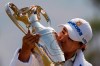 Mirim Lee, of South Korea, kisses the championship trophy after winning the LPGA's ANA Inspiration golf tournament at Mission Hills Country Club in Rancho Mirage, Calif., Sunday Sept. 13, 2020. (AP Photo/Ringo H.W. Chiu)