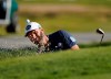 Dustin Johnson hits out of the green side bunker on the 16th hole during the first round of the Genesis Invitational golf tournament at Riviera Country Club, Thursday, Feb. 18, 2021, in the Pacific Palisades area of Los Angeles. (AP Photo/Ryan Kang)