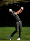Dustin Johnson hits his second shot on the 12th hole during the final round of the Genesis Invitational golf tournament at Riviera Country Club, Sunday, Feb. 16, 2020, in the Pacific Palisades area of Los Angeles. (AP Photo/Ryan Kang)