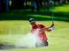 Tiger Woods hits out of a greenside bunker on the 17th hole during the final round of the Genesis Invitational golf tournament at Riviera Country Club, Sunday, Feb. 16, 2020, in the Pacific Palisades area of Los Angeles. (AP Photo/Ryan Kang)