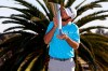 Max Homa kisses his trophy on the practice green after winning the Genesis Invitational golf tournament at Riviera Country Club, Sunday, Feb. 21, 2021, in the Pacific Palisades area of Los Angeles. (AP Photo/Ryan Kang)
