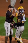 San Diego Padres relief pitcher Craig Stammen, left, is congratulated by catcher Austin Nola after the team's 7-0 victory over the Oakland Athletics in baseball game in Oakland, Calif., Friday, Sept. 4, 2020. (AP Photo/Tony Avelar)