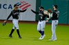 Colorado Rockies left fielder Raimel Tapia (15), center fielder Kevin Pillar (11) and right fielder Sam Hilliard (22) celebrate after a 7-2 victory against the San Francisco Giants in a baseball game on Monday, Sept. 21, 2020, in San Francisco. (AP Photo/Tony Avelar)