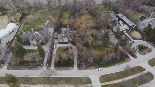 These homes on Wellington Crescent received some of the largest rebate cheques for dwellings in Winnipeg, including one for $4,594 and another for $3,770. (CBC)