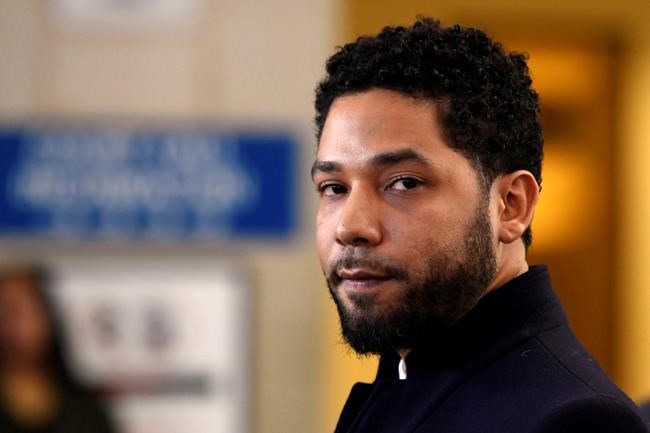 FILE - In this March 26, 2019, file photo, actor Jussie Smollett talks to the media before leaving Cook County Court in Chicago. Smollett is scheduled to make his first court appearance on Monday, Feb. 24, 2020, in Chicago since a special prosecutor announced that he'd been indicted for a second time on charges that he lied when he told police he was a victim of a racist and anti-gay attack. (AP Photo/Paul Beaty, File)