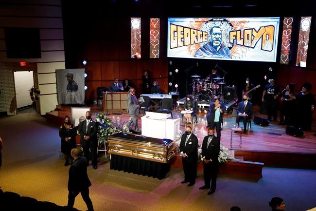 Guests gather at North Central University Thursday, June 4, 2020, before a memorial service for George Floyd in Minneapolis. (AP Photo/Julio Cortez)