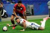 Lyon's Memphis Depay, down, challenges for the ball with Lille's Reinildo Isnard Mandava, up, during their French League One soccer match in Decines, near Lyon, central France, Sunday, April 25, 2021. (AP Photo/Laurent Cipriani)