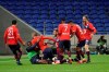 Lille's Burak Yilmaz, third left, celebrates with his teammates after he scored a goal against Lyon during their French League One soccer match in Decines, near Lyon, central France, Sunday, April 25, 2021. (AP Photo/Laurent Cipriani)