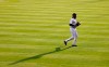 FILE - Colorado Rockies right fielder Charlie Blackmon casts a long shadow as he takes his position in the third inning of a baseball game against the San Diego Padres in this file photograph taken Saturday, Aug. 1, 2020, in Denver. Success doesn't push the ever-thinking, ever-tinkering Charlie Blackmon nearly as much as failure. (AP Photo/David Zalubowski, File)