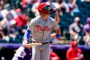 Philadelphia Phillies' Bryce Harper heads up the first base line after hitting a solo home run off Colorado Rockies starting pitcher Jon Gray in the first inning of a baseball game Sunday, April 25, 2021, in Denver. (AP Photo/David Zalubowski)