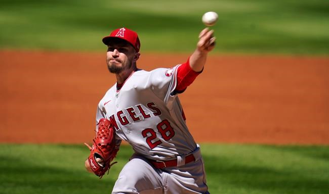 Los Angeles Angels starting pitcher Andrew Heaney works against the Colorado Rockies in the first inning of a baseball game Sunday, Sept. 13, 2020, in Denver. (AP Photo/David Zalubowski)