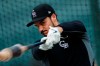FILE - In this Friday, Sept. 27, 2019, file photo, Colorado Rockies third baseman Nolan Arenado warms up before a baseball game against the Milwaukee Brewers in Denver. Team owner Dick Monfort and general manager Jeff Bridich will hold a zoom press conference Tuesday, Feb. 2, 2021, to discuss the trade of the team's star third baseman, Nolan Arenado, to the St. Louis Cardinals. (AP Photo/David Zalubowski, File)