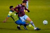 Seattle Sounders defender Kelvin Leerdam, left, collides with Colorado Rapids forward Nicolas Benezet in the first half of an MLS soccer match Sunday, Nov. 1, 2020, in Commerce City, Colo. (AP Photo/David Zalubowski)