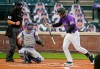 Colorado Rockies' Nolan Arenado reacts after striking out against Los Angeles Dodgers starting pitcher Alex Wood, while catcher Austin Barnes, center, and home plate umpire Mark Ripperger watch during the first inning of a baseball game Friday, Sept. 18, 2020, in Denver. (AP Photo/David Zalubowski)