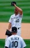 Colorado Rockies relief pitcher Tyler Kinley, back, waits to be pulled from the mound by manager Bud Black, (10) after Kinley gave up a double to allow in three runs to Arizona Diamondbacks' David Peralta in the seventh inning of a baseball game Wednesday, Aug. 12, 2020, in Denver. (AP Photo/David Zalubowski)