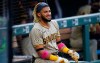 San Diego Padres' Fernando Tatis Jr. smiles as he waits to bat in the on-deck circle in the first inning of a baseball game against the Colorado Rockies, Saturday, Aug. 29, 2020, in Denver. (AP Photo/David Zalubowski)