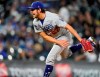 Los Angeles Dodgers starting pitcher Trevor Bauer works against the Colorado Rockies in the fifth inning of a baseball game Friday, April 2, 2021, in Denver. (AP Photo/David Zalubowski)