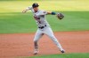 Houston Astros third baseman Alex Bregman throws to first base to put out Colorado Rockies' Trevor Story in the first inning of a baseball game Wednesday, Aug. 19, 2020, in Denver. (AP Photo/David Zalubowski)