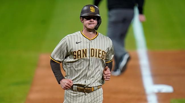 San Diego Padres' Wil Myers circles the bases after hitting a solo home run off Colorado Rockies starting pitcher German Marquez in the fourth inning of a baseball game, Monday, Aug. 31, 2020, in Denver. (AP Photo/David Zalubowski)