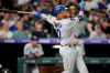 Los Angeles Dodgers' Justin Turner watches his two-run double off Colorado Rockies relief pitcher Tyler Kinley during the ninth inning of a baseball game Saturday, July 17, 2021, in Denver. (AP Photo/David Zalubowski)