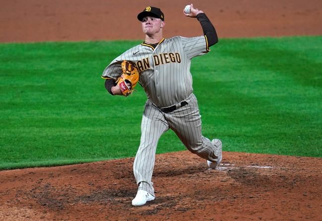 San Diego Padres relief pitcher Adrian Morejon works against the Colorado Rockies in the seventh inning of a baseball game Monday, Aug. 31, 2020, in Denver. The padres won 6-0. (AP Photo/David Zalubowski)