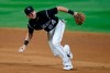 Colorado Rockies second baseman Ryan McMahon picks up an infield single off the bat of Texas Rangers' Todd Frazier in the ninth inning of a baseball game Friday, Aug. 14, 2020, in Denver. Texas won 3-2. (AP Photo/David Zalubowski)