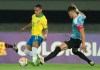 Brazil's Antony, left, fights for the ball with Uruguay's Facundo Waller during a South America Olympic qualifying U23 soccer match at the Hernan Ramirez Villegas stadium in Pereira, Colombia, Wednesday, Jan. 22, 2020. (AP Photo/Fernando Vergara)