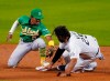 Oakland Athletics' Tony Kemp (5) is late with the tag on Colorado Rockies' Matt Kemp (25) during the sixth inning of a baseball game, Tuesday Sept. 15, 2020, in Denver. Kemp advanced on a sacrifice fly by Josh Fuentes. (AP Photo/Jack Dempsey)