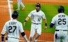 Colorado Rockies' Chris Owings (12) celebrates a run with teammates Trevor Story (27) and Matt Kemp (25) against the San Francisco Giants during the sixth inning of a baseball game, Monday, Aug. 3, 2020, in Denver. (AP Photo/Jack Dempsey)